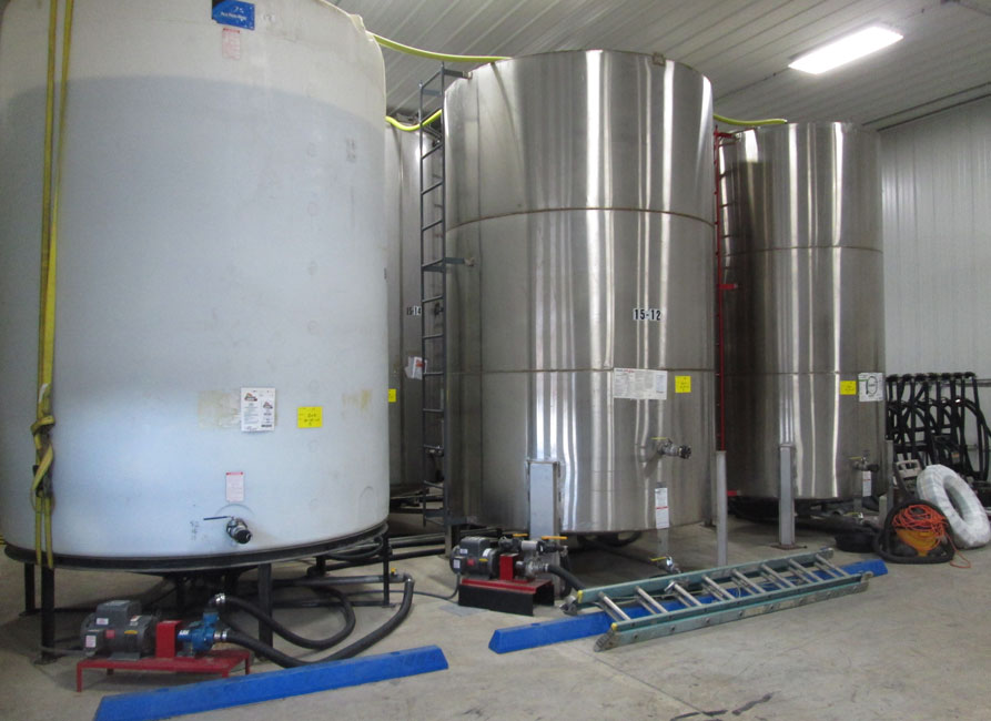 photo shows bulk liquid pesticide tanks stored at a pesticide facility. 