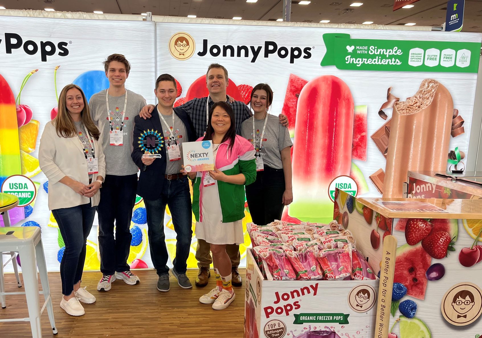 six people standing in the Jonny Pops exhibit