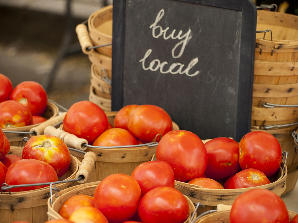 tomatoes with a "Buy Local" sign