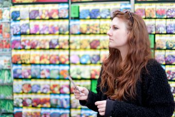 woman standing by seed stand