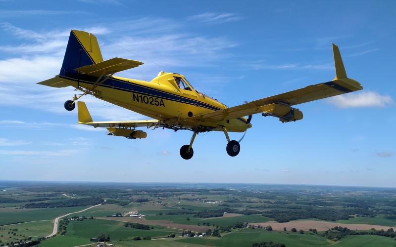 yellow plane flying