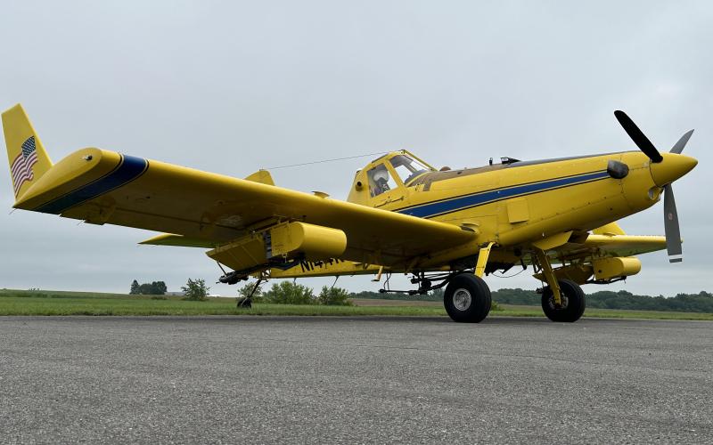 yellow plane on tarmac